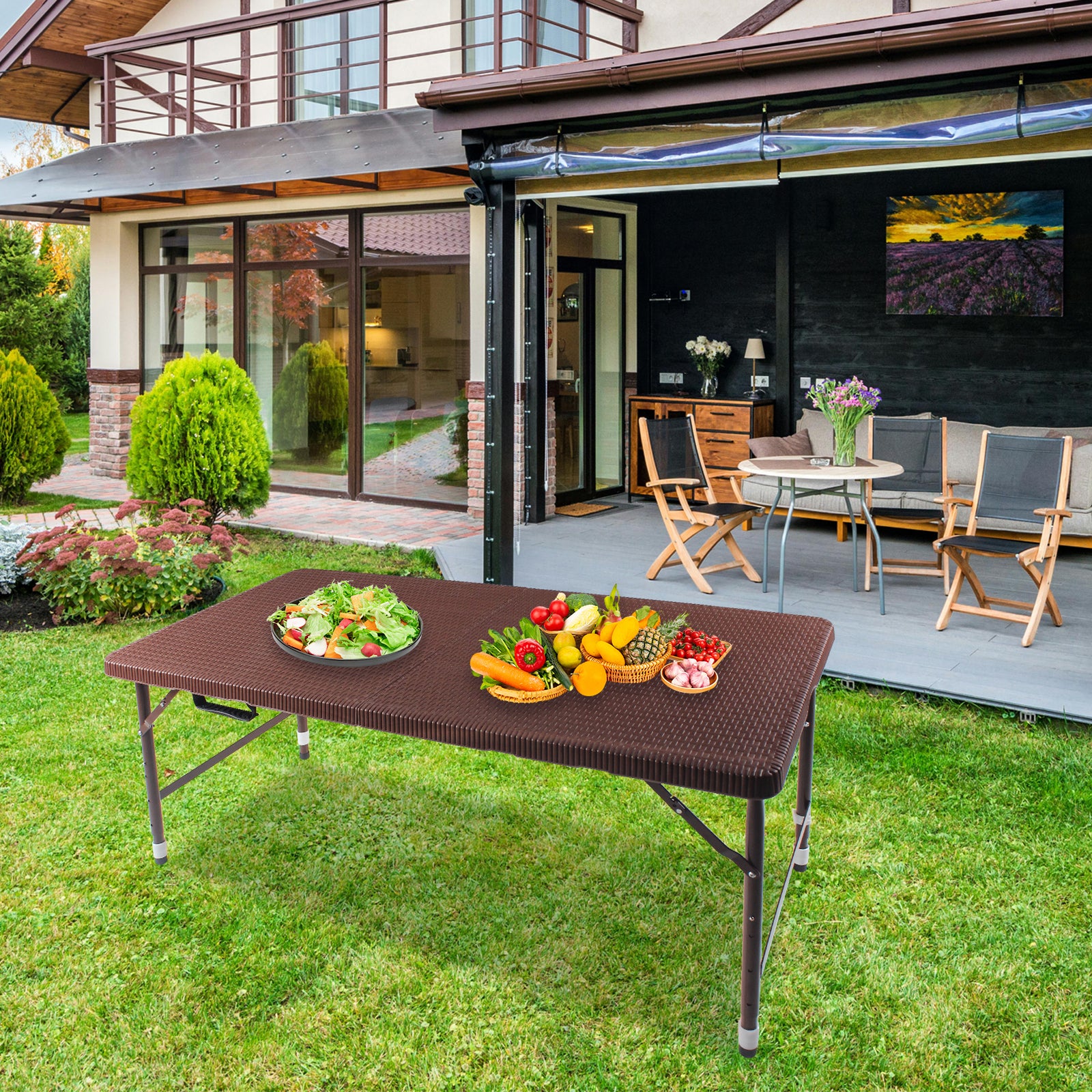 Dark brown folding picnic table with textured surface laden with fresh salad and fruits
