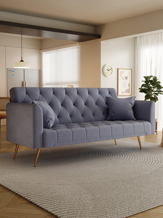 Tufted grey velvet sofa with diamond stitch pattern and gold tapered legs
