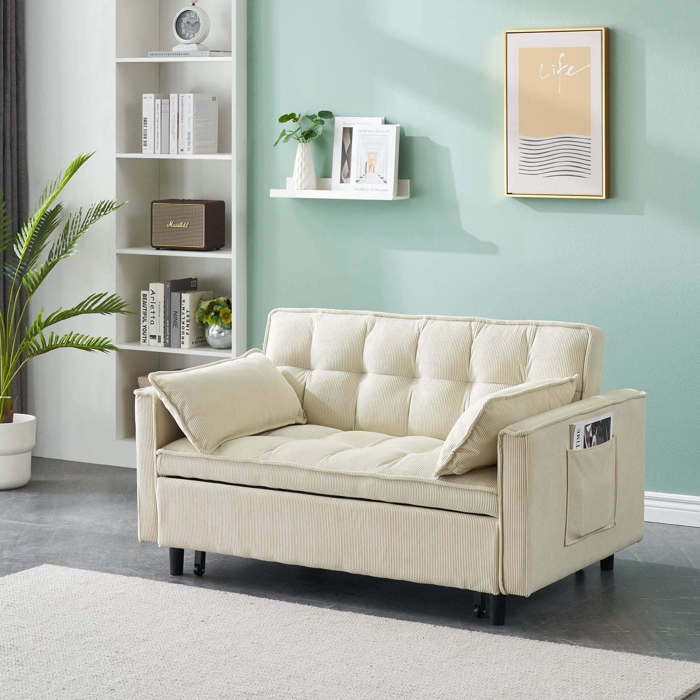 Cream corduroy sofa with tufted cushions and convenient side pocket for magazines