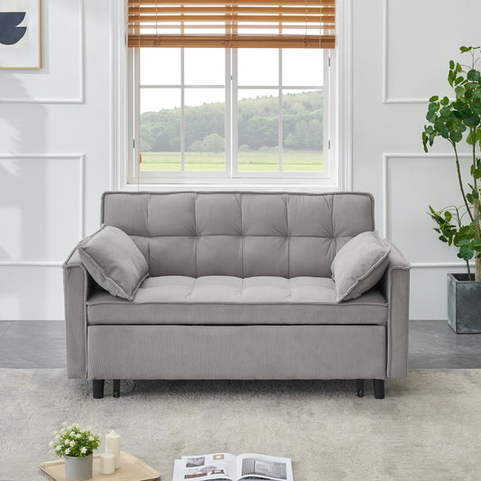 Grey corduroy sofa with tufted cushions and two throw pillows for living room comfort