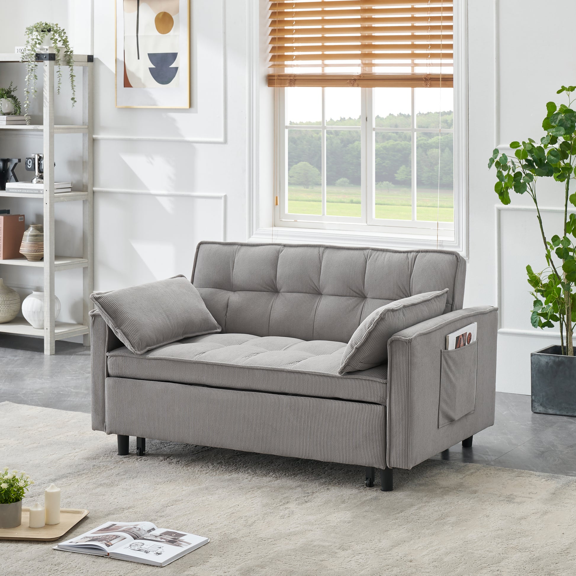 Gray corduroy sofa bed with tufted cushions and side pocket