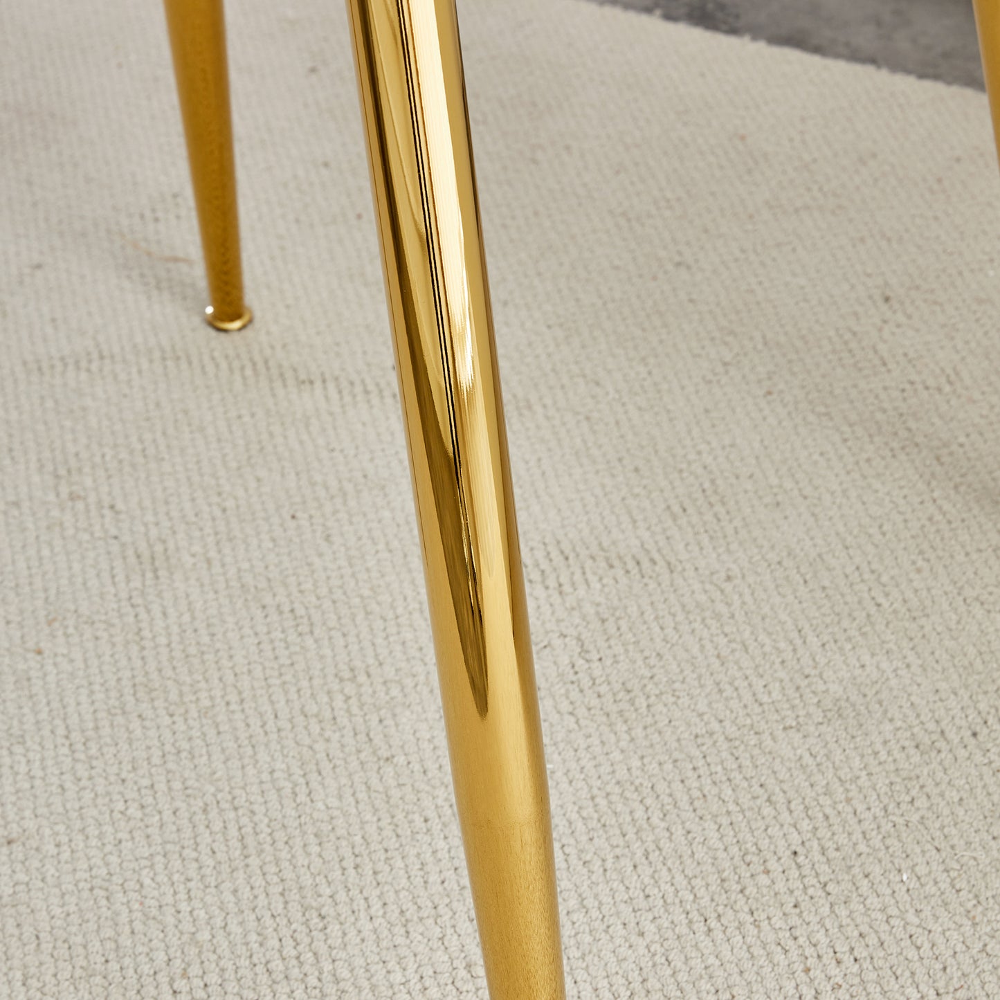 Shiny gold tapered table leg with polished finish