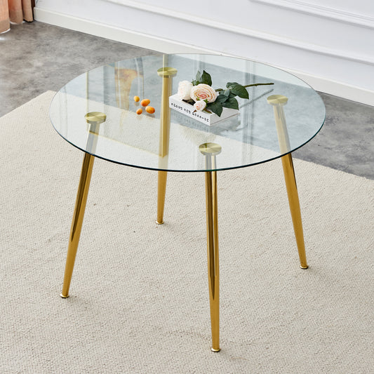 Round glass coffee table with gold legs and decorative roses