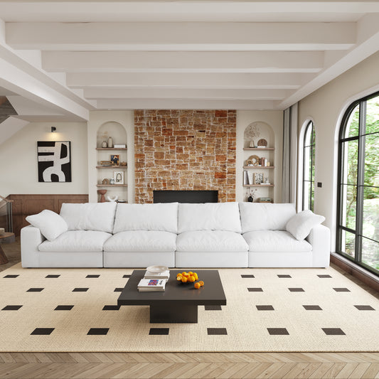 Modular white fabric sectional sofa with plush cushions perfect for a modern living room