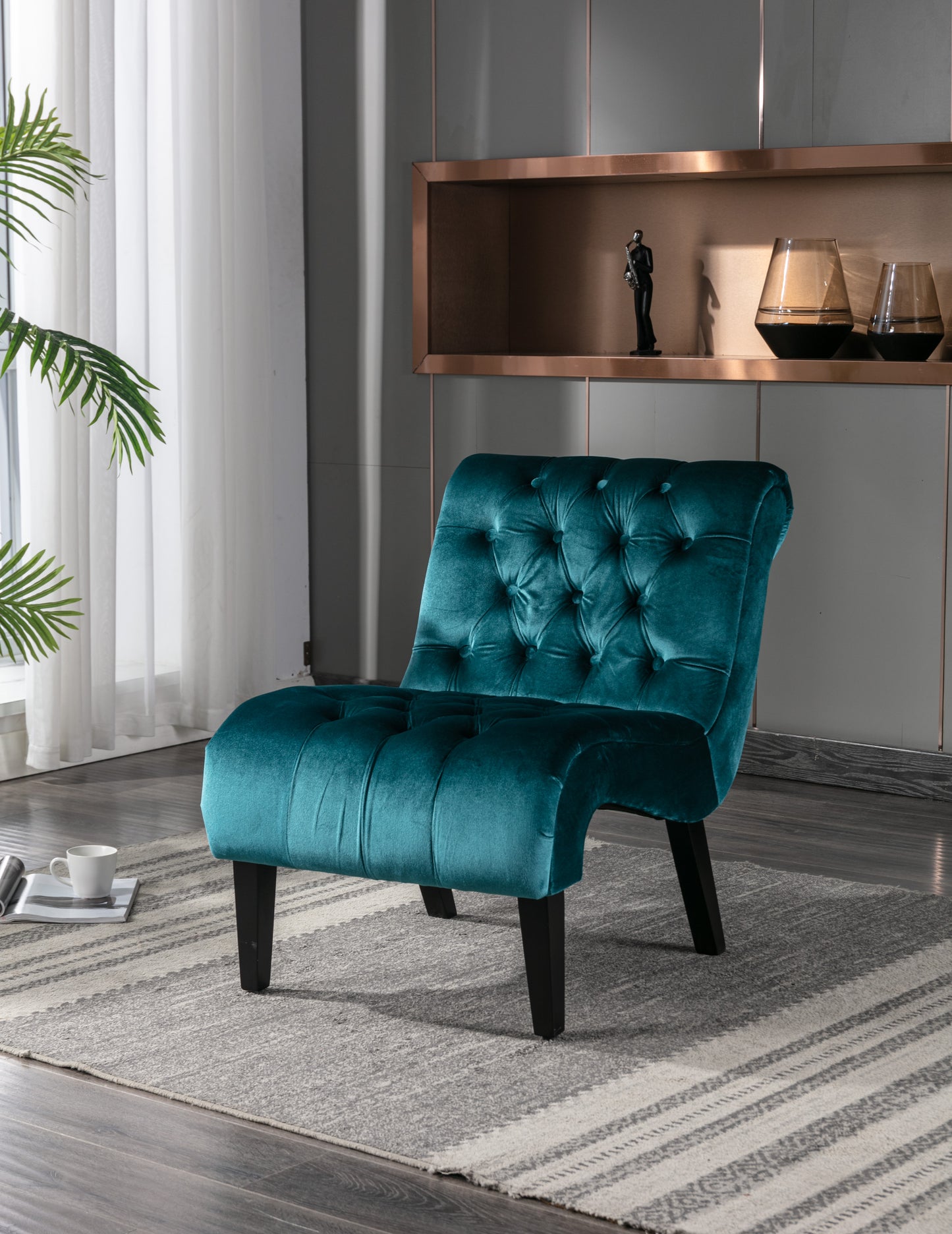 Teal velvet accent chair with diamond tufting and dark wooden legs perfect for living rooms