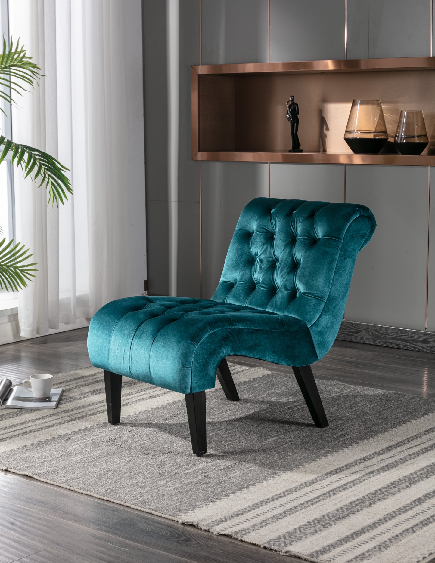 Teal velvet accent chair with deep tufting modern design and black tapered legs