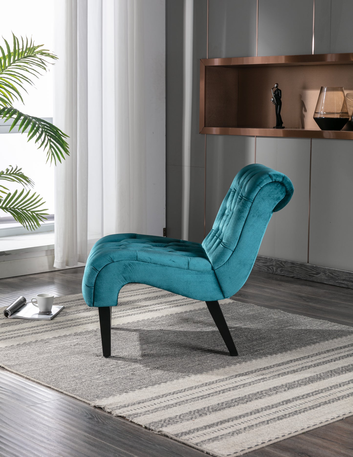 Turquoise velvet accent chair with button tufting and curved back for modern living room