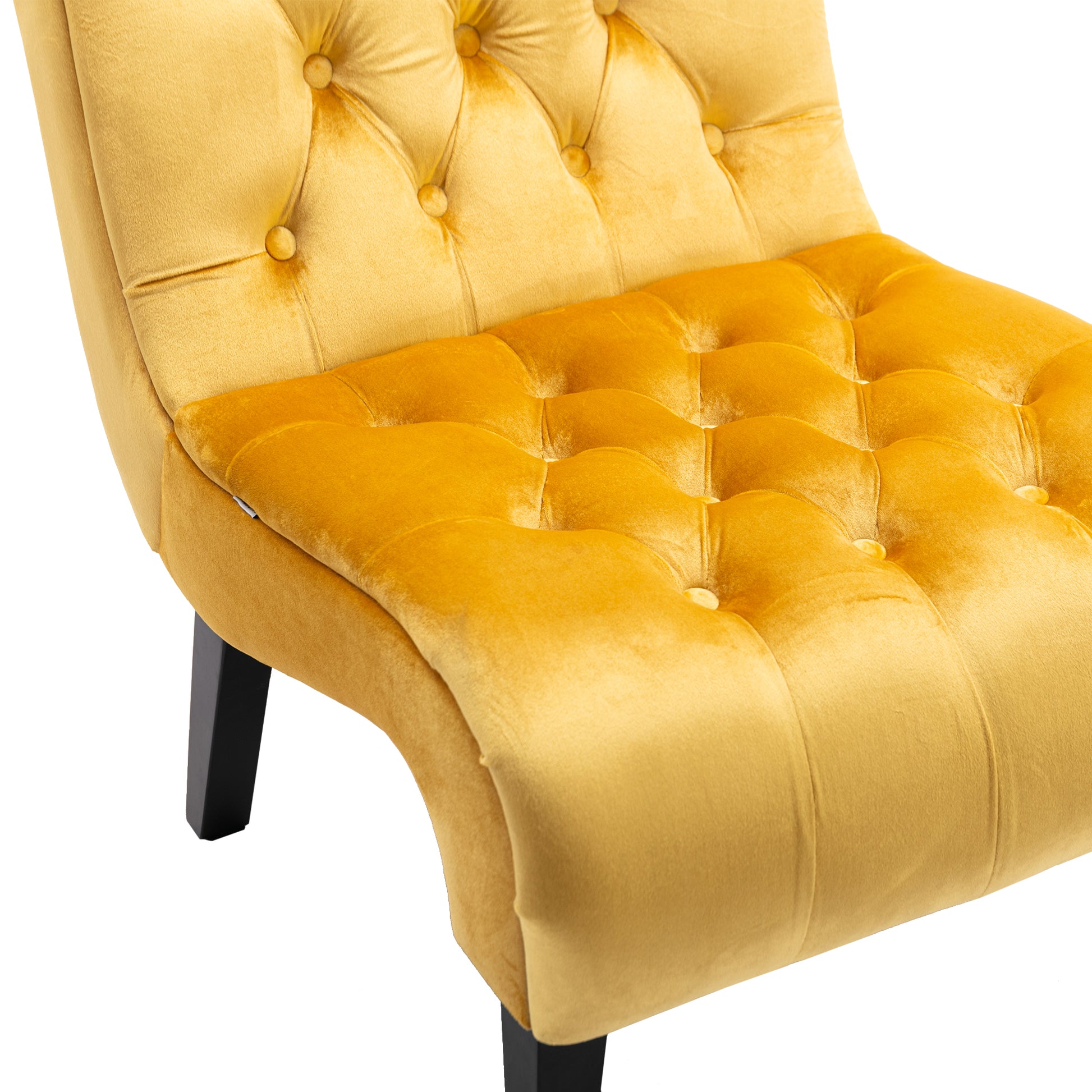 Mustard yellow velvet accent chair with button tufting and black tapered legs