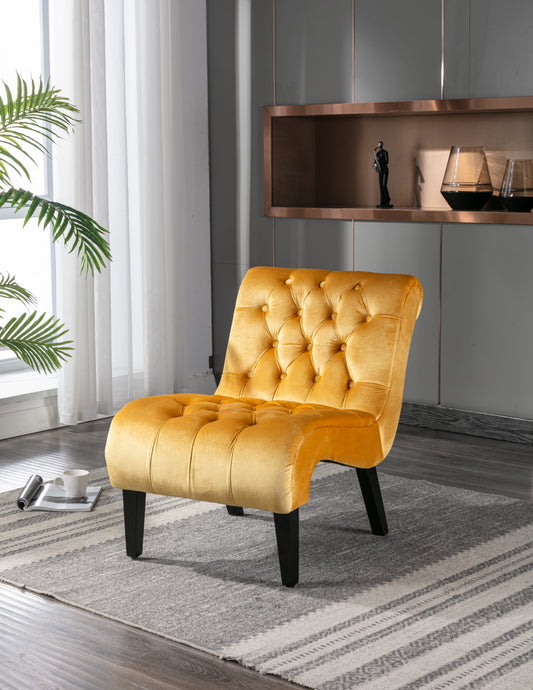 Tufted velvet accent chair in vibrant mustard yellow featuring a curved back and black legs