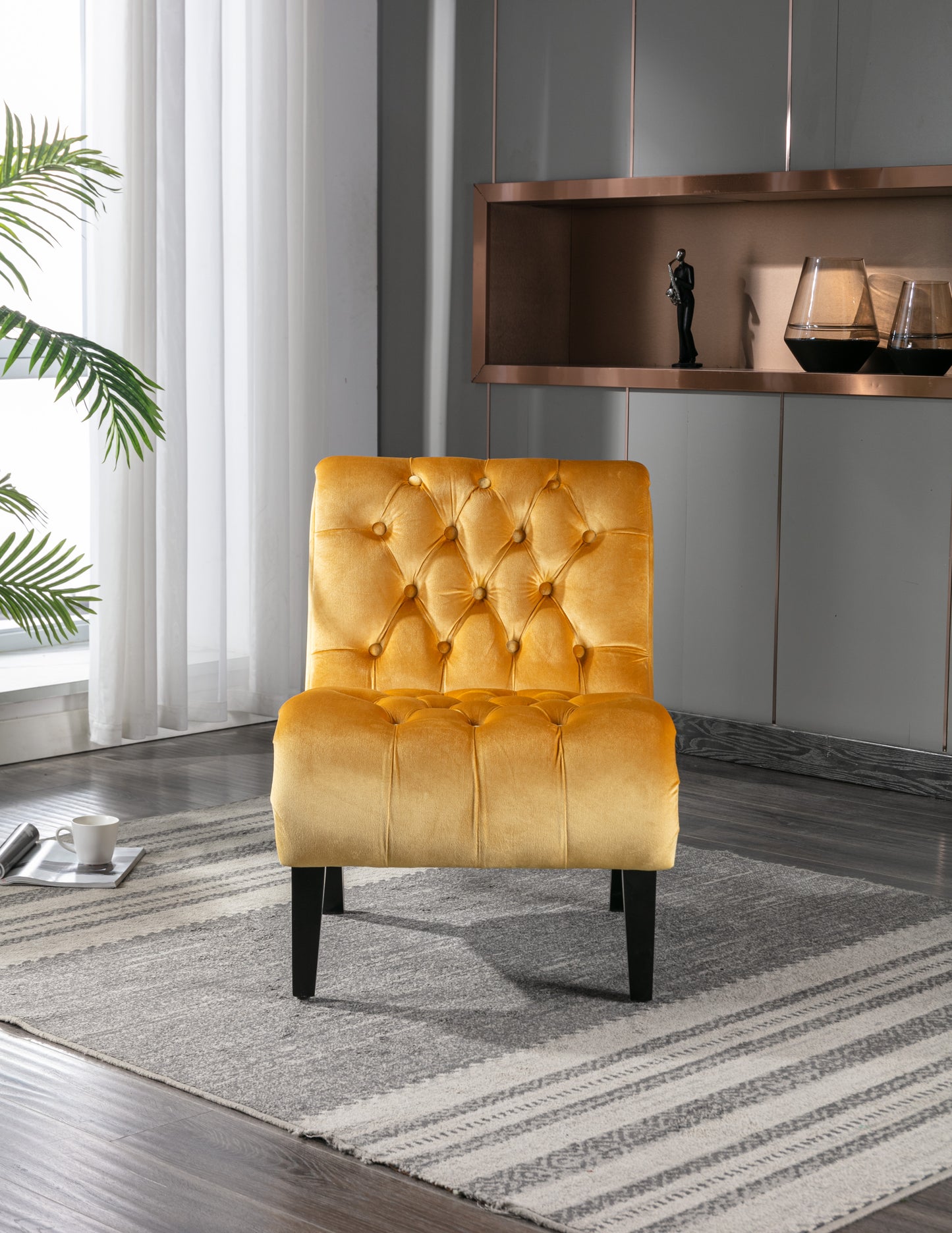 Tufted accent chair in rich mustard velvet featuring elegant button details and sleek black legs