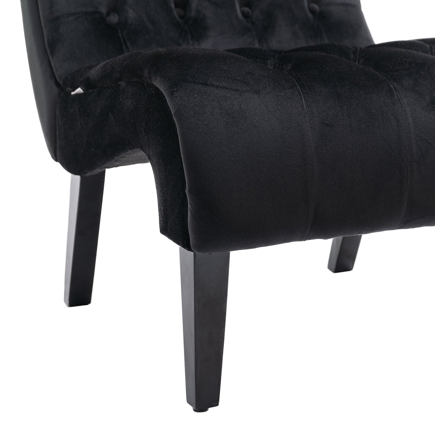 Black velvet accent chair with button tufting and sturdy wooden legs