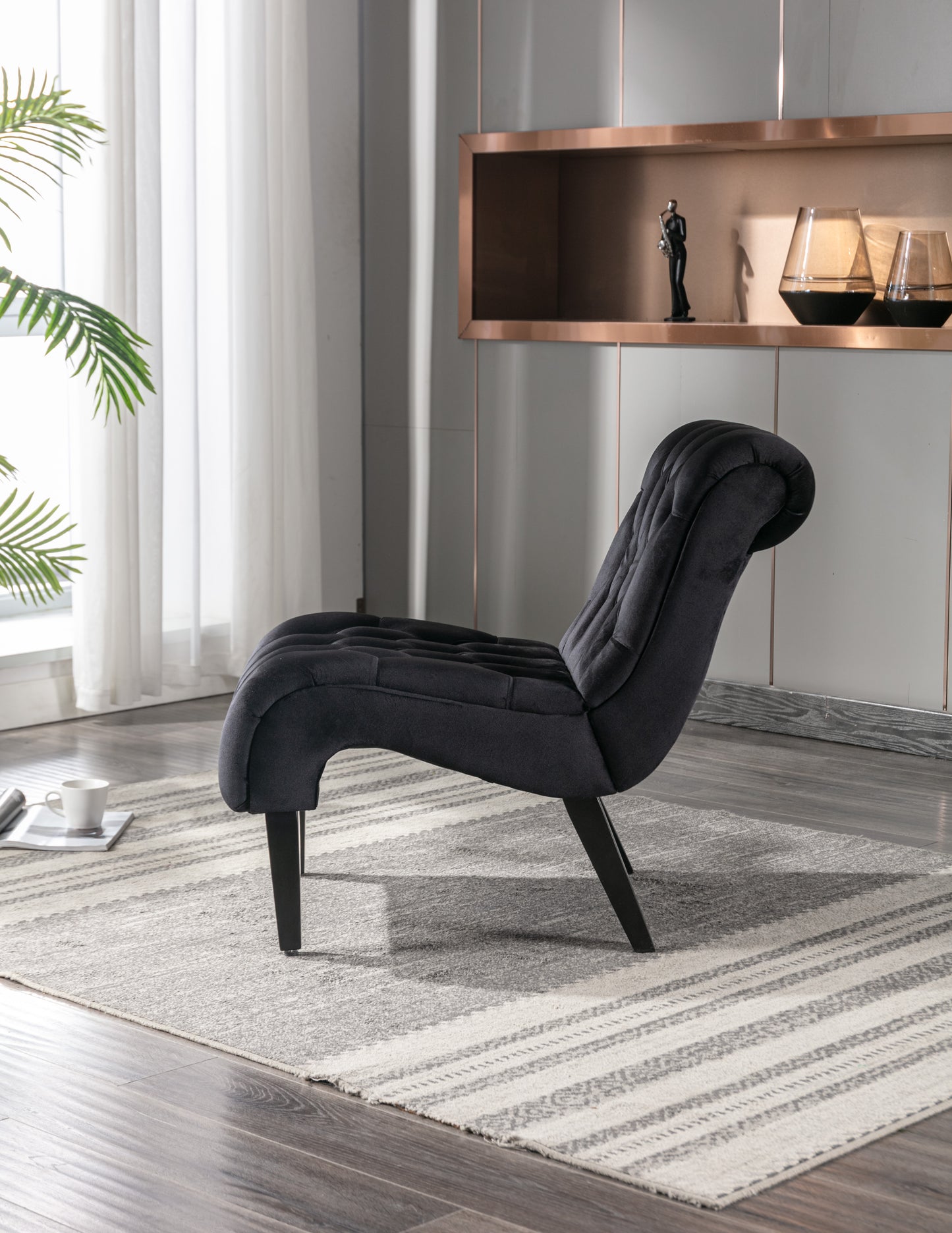 Tufted charcoal velvet accent chair with curved back and dark wooden legs