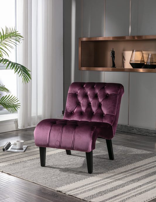 Plush velvet accent chair in deep plum with diamond tufting and black wooden legs