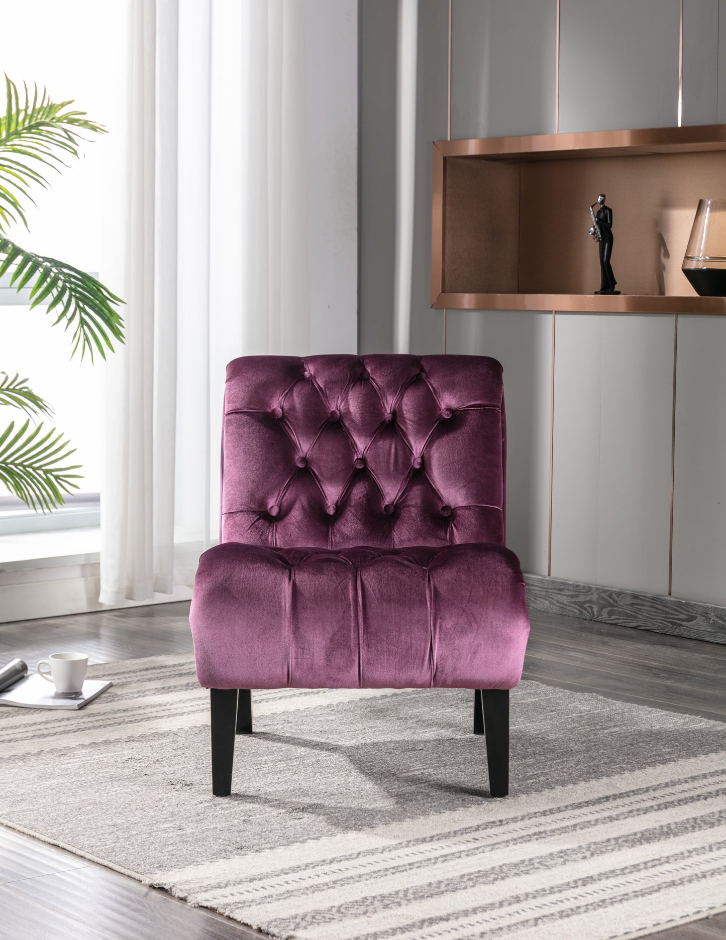 Plush velvet accent chair in deep plum with diamond tufting and dark wood legs