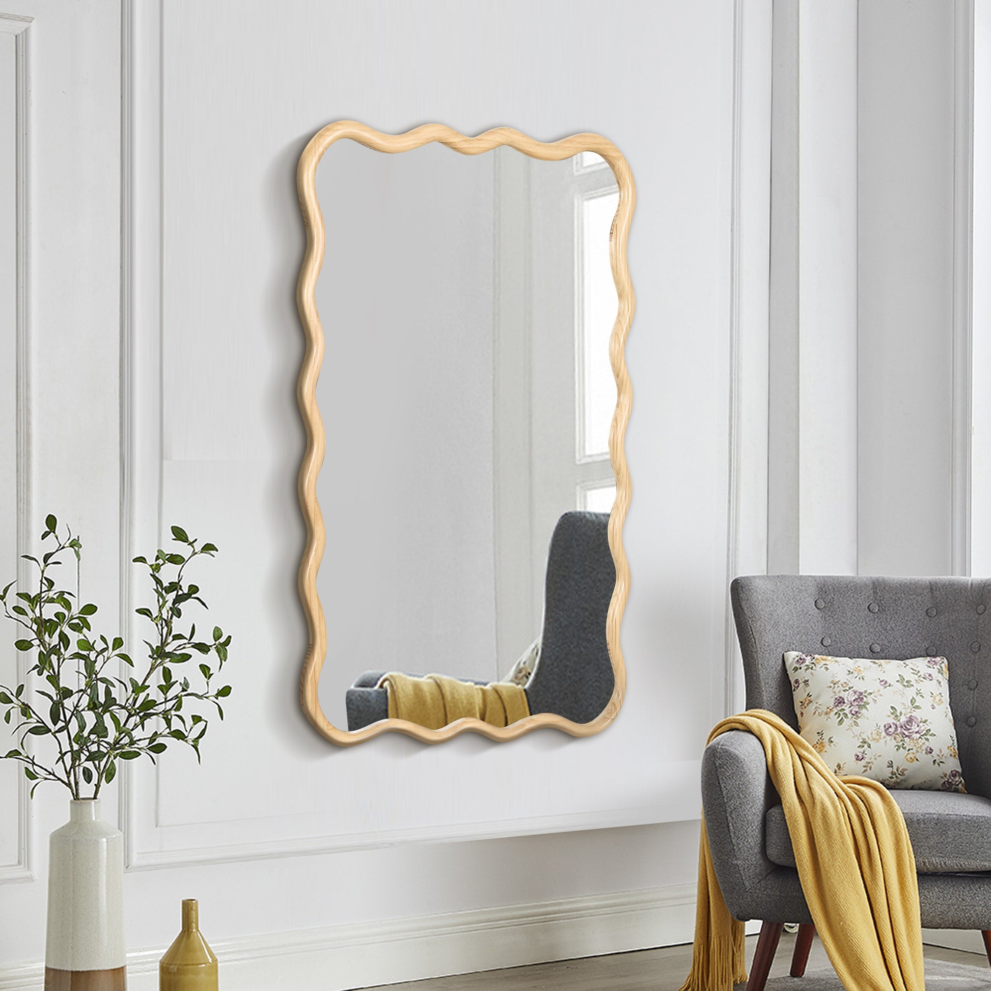 Asymmetrical wood frame mirror with a wavy design perfect for modern decor