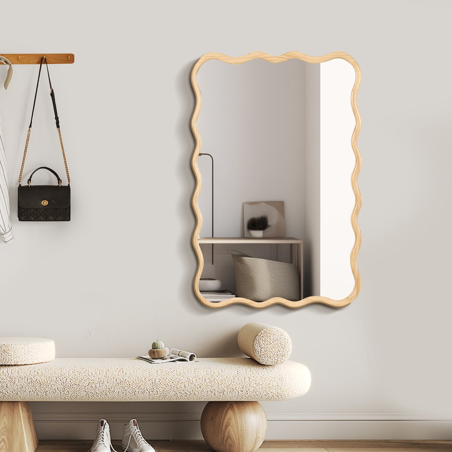 Modern wavy framed mirror with natural wood finish accentuating entryway decor