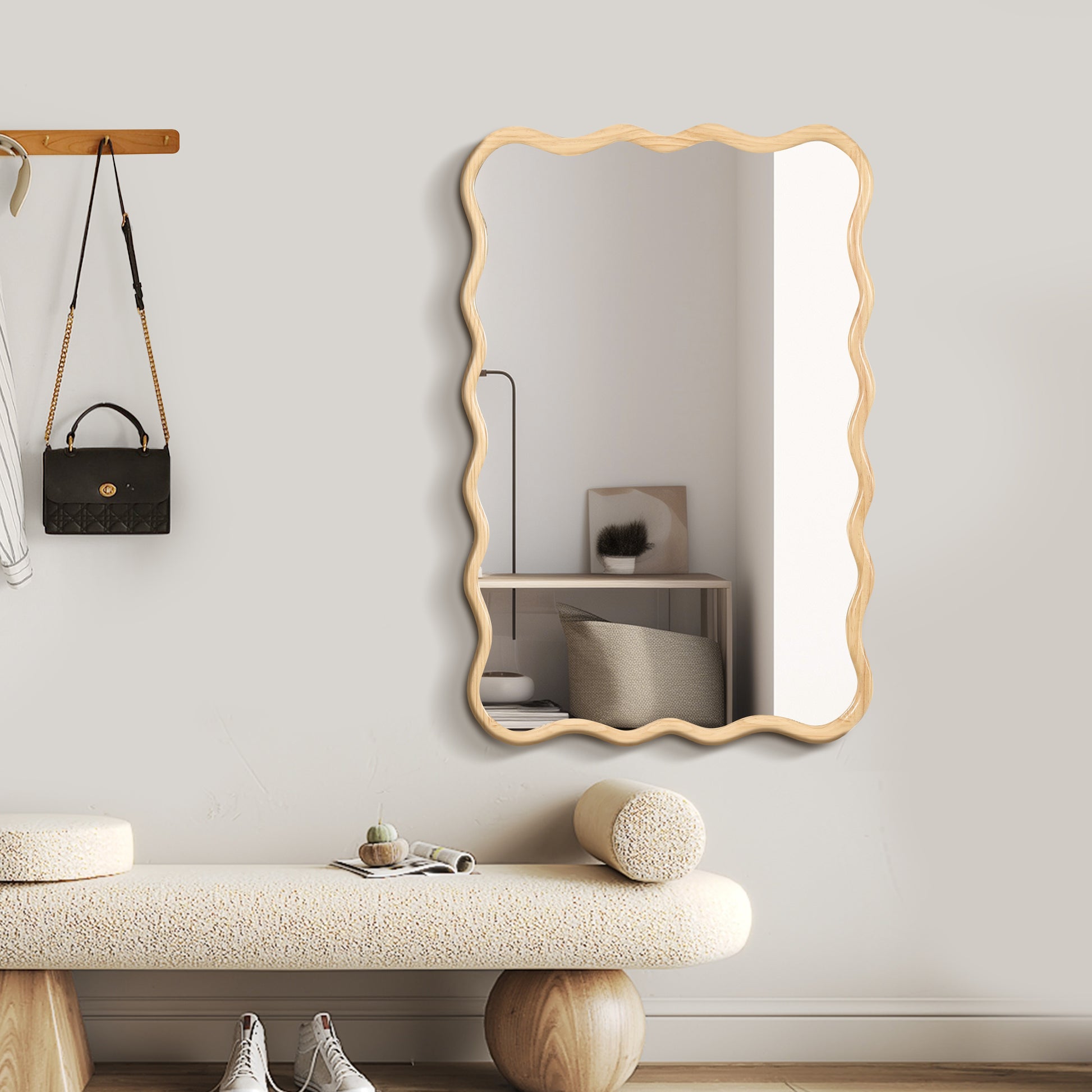 Modern wavy framed mirror with natural wood finish accentuating entryway decor