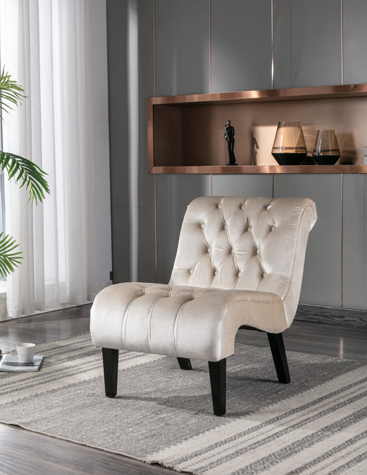 Cream velvet accent chair with diamond tufting and dark wooden legs