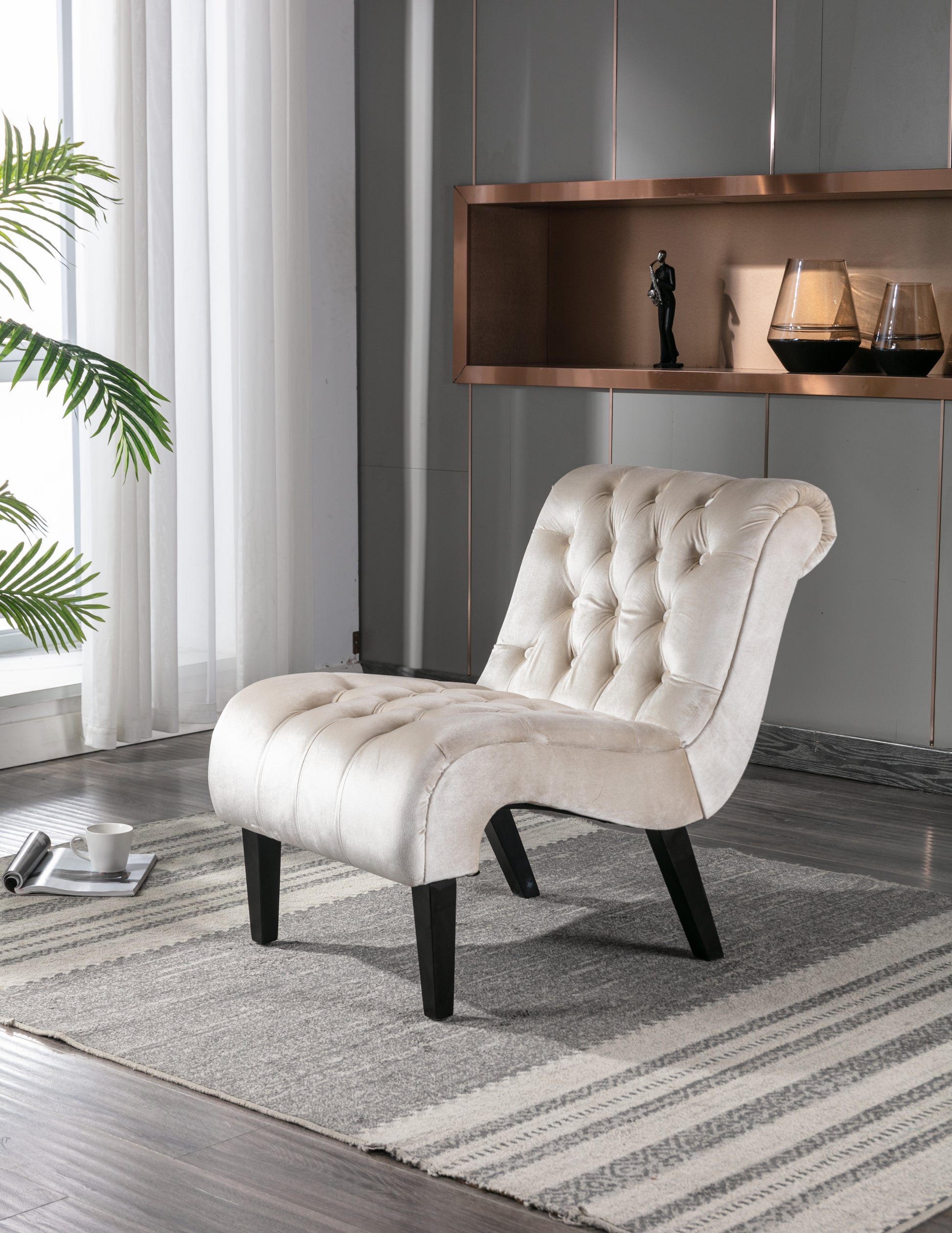 Elegant cream velvet accent chair with tufted details and dark wood legs