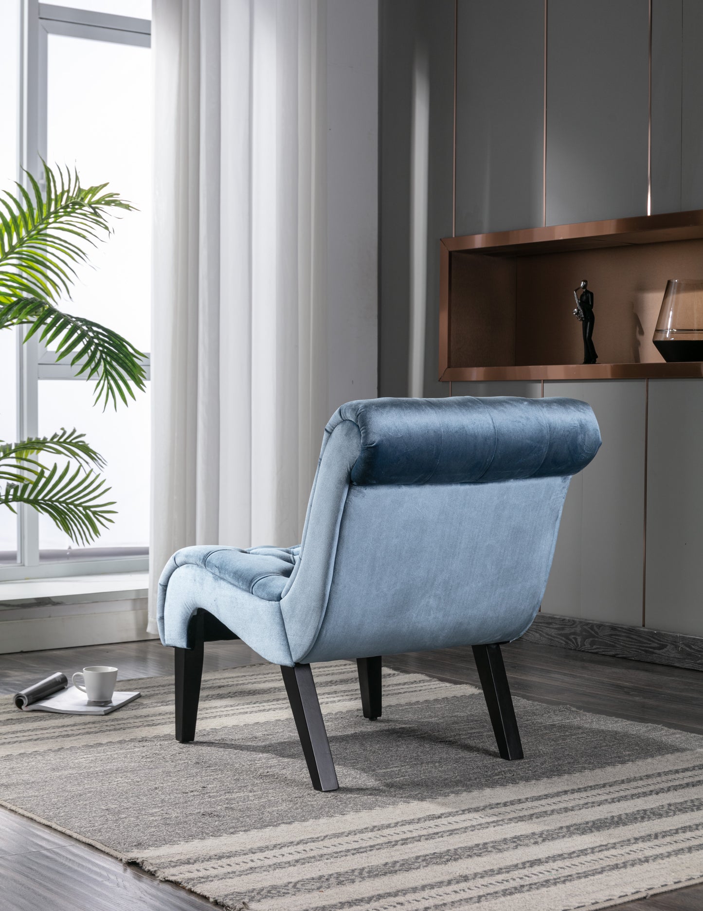 Light blue velvet accent chair with tufted back dark tapered legs