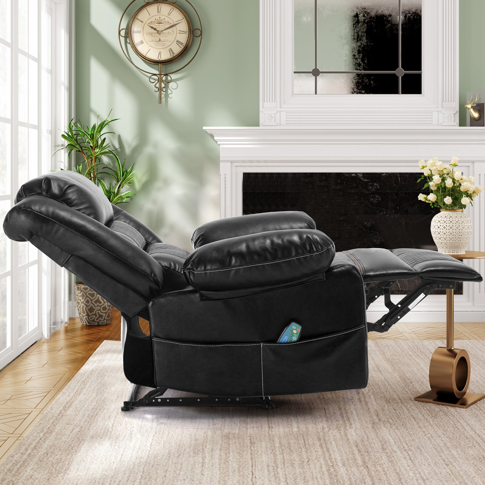 Black leather power recliner chair with side pocket and remote