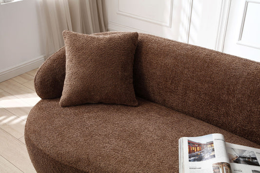 Plush brown boucle fabric sofa with a textured throw pillow ideal for modern living rooms
