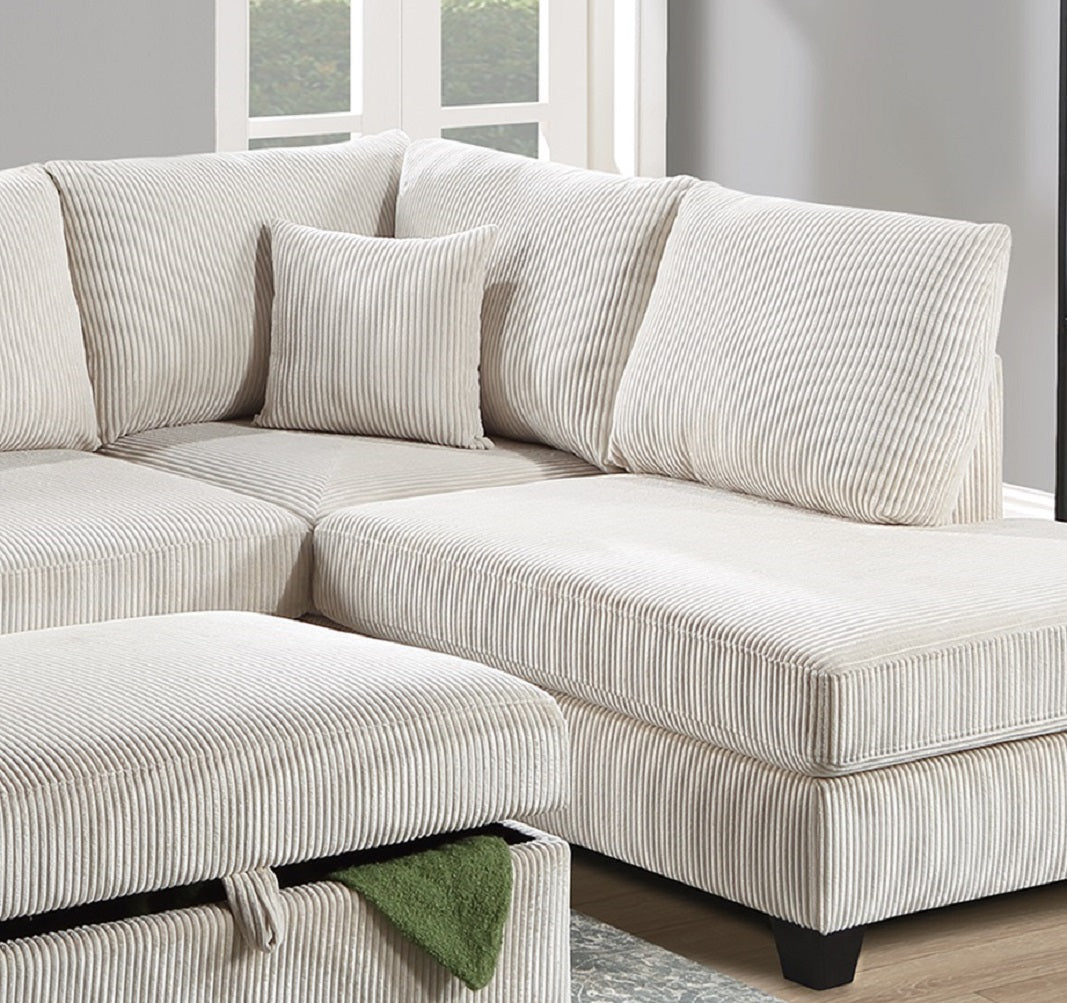 Cream corduroy sectional sofa with plush throw pillows and ottoman
