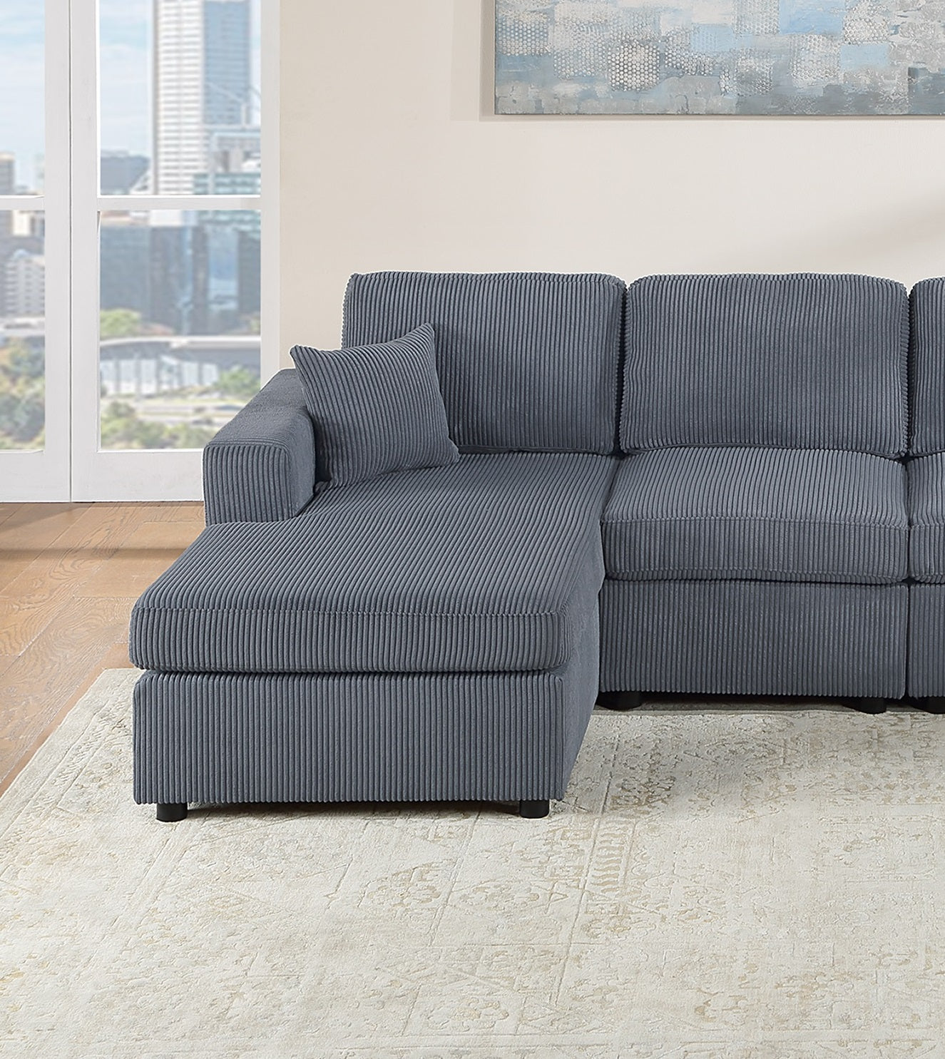 Gray corduroy sectional sofa with chaise lounge and matching throw pillow