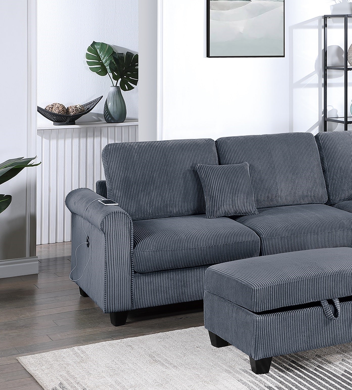 Dark grey corduroy sectional sofa with builtin USB charging port on armrest