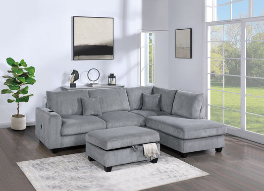 Grey corduroy sectional sofa with chaise and storage ottoman in a modern living room setting
