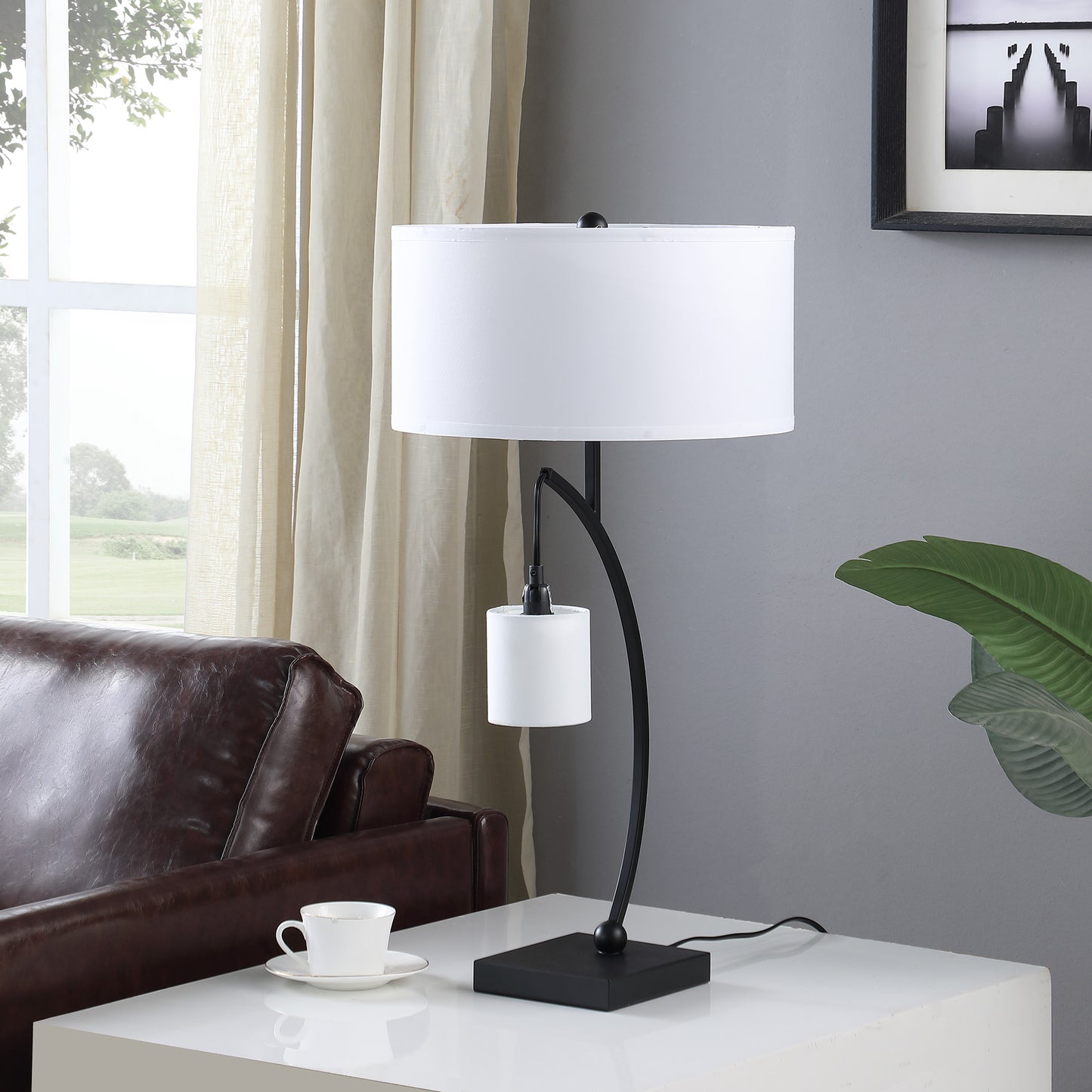 Modern black metal table lamp with white drum shade perfect for bedside reading