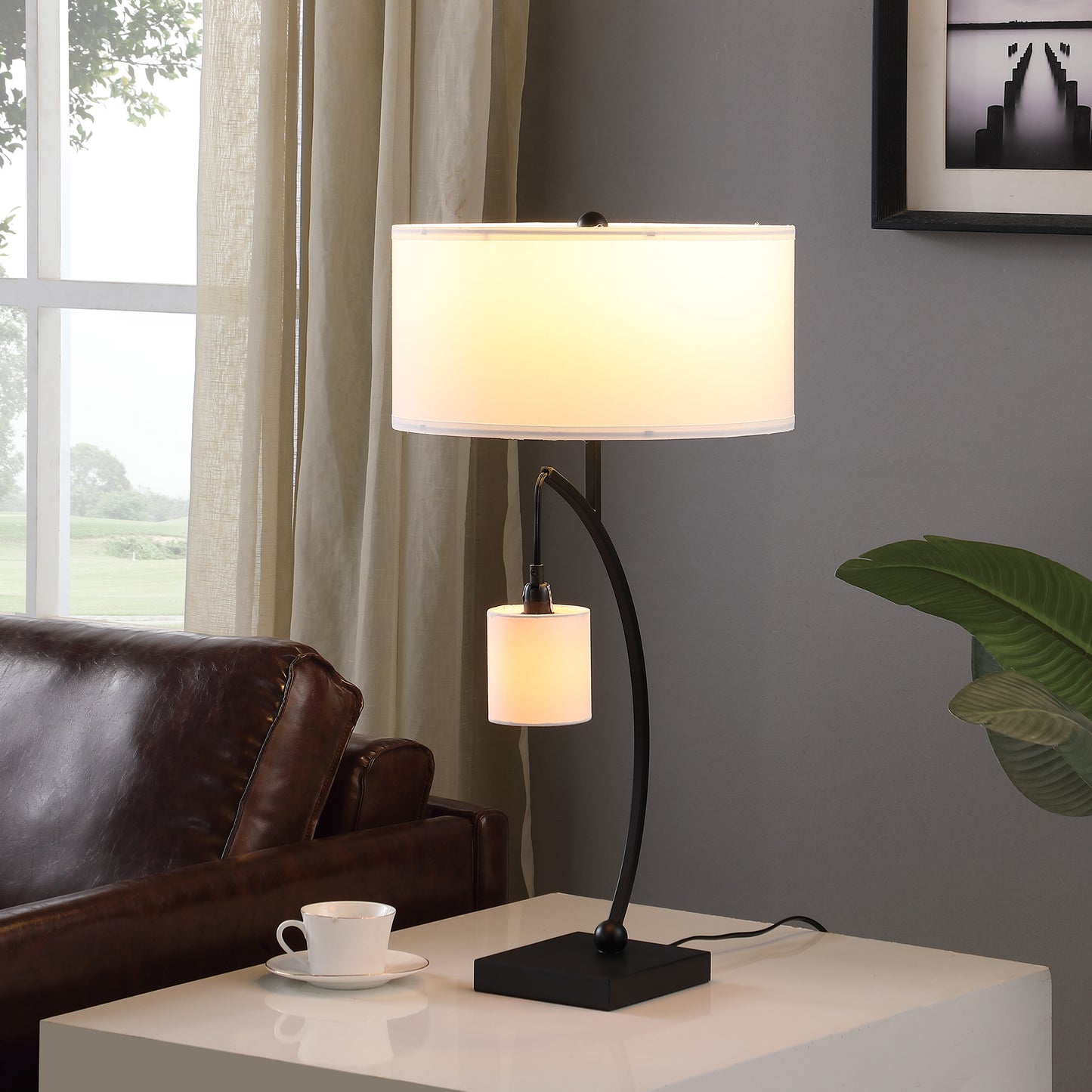 Modern black metal table lamp with dual white fabric shades perfect for ambient lighting