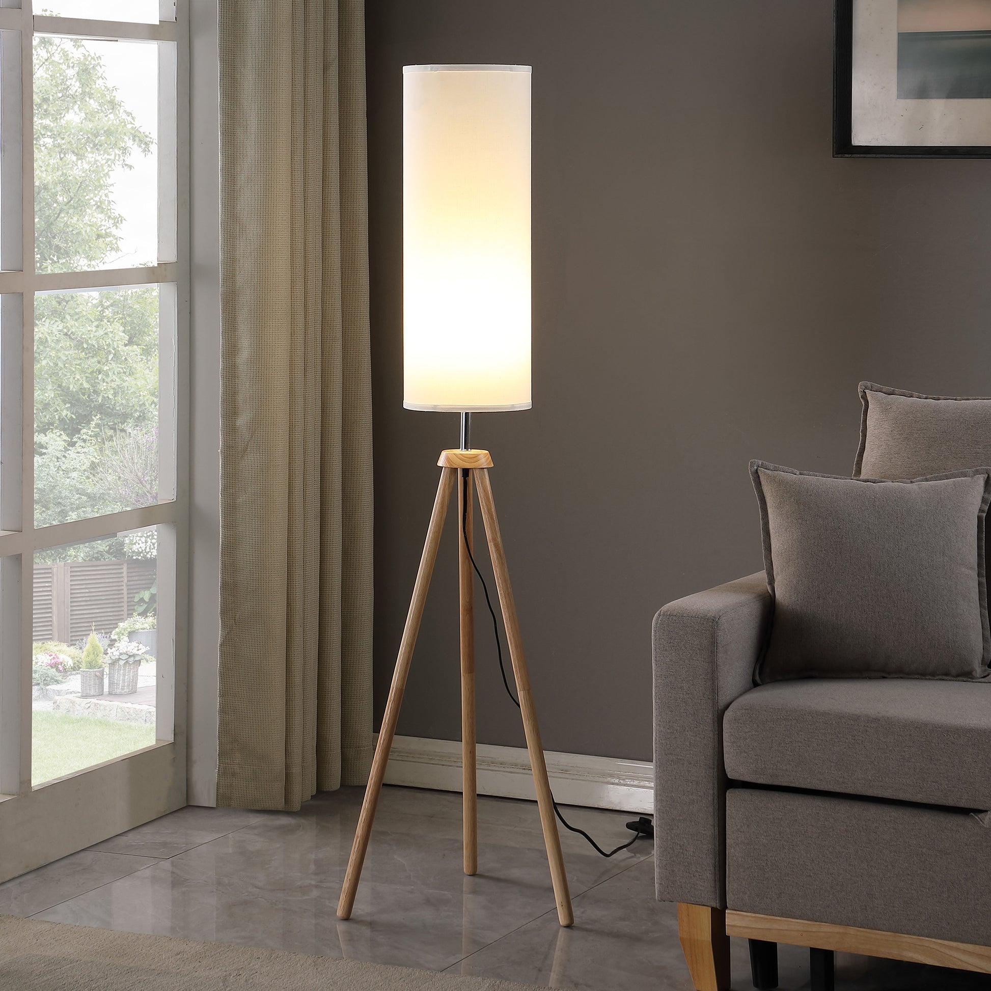 Minimalist white cylindrical lampshade floor lamp with natural wood tripod base