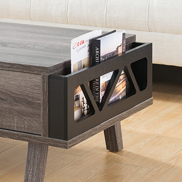 Gray wood coffee table with magazine rack holding two books and a modern design