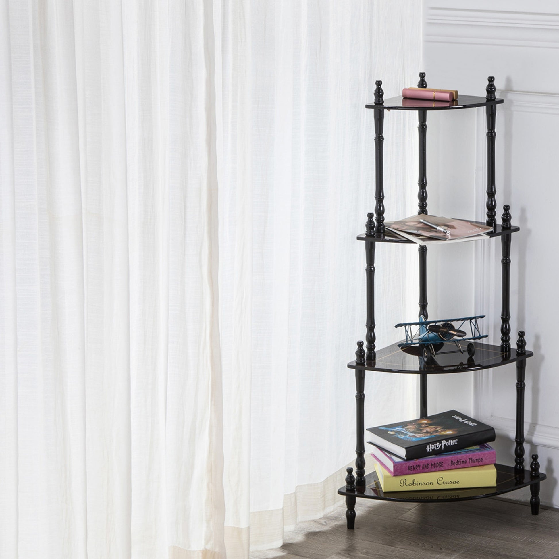 Black metal corner shelf with glass tiers ideal for displaying decorative items