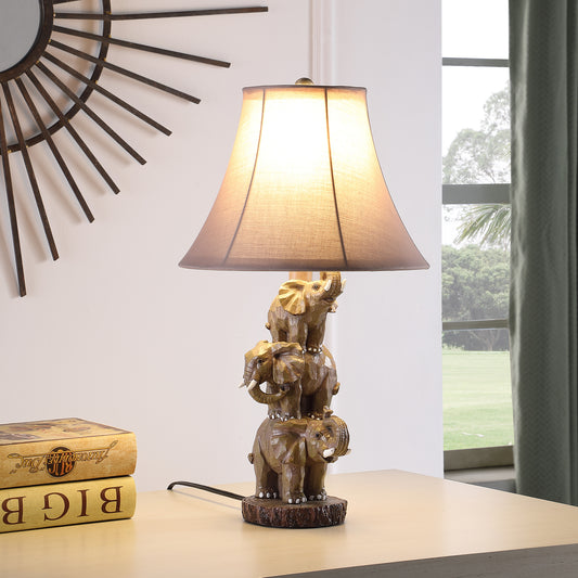 Elephant stack table lamp with faux wood base and brown linen shade