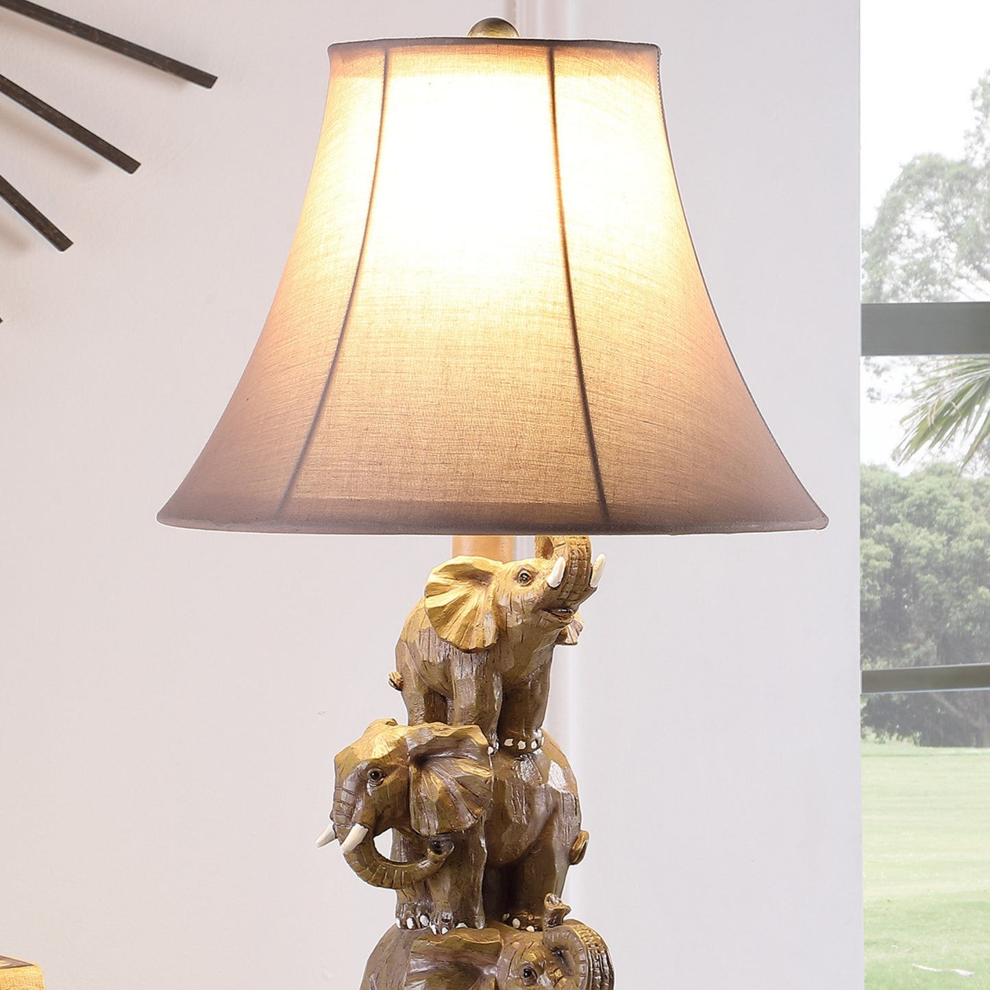 Ornate gold elephant lamp with a textured fabric shade perfect for a unique accent light