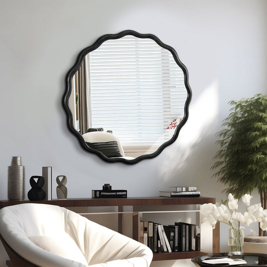 Scalloped black wall mirror with an organic wavy frame for modern living rooms