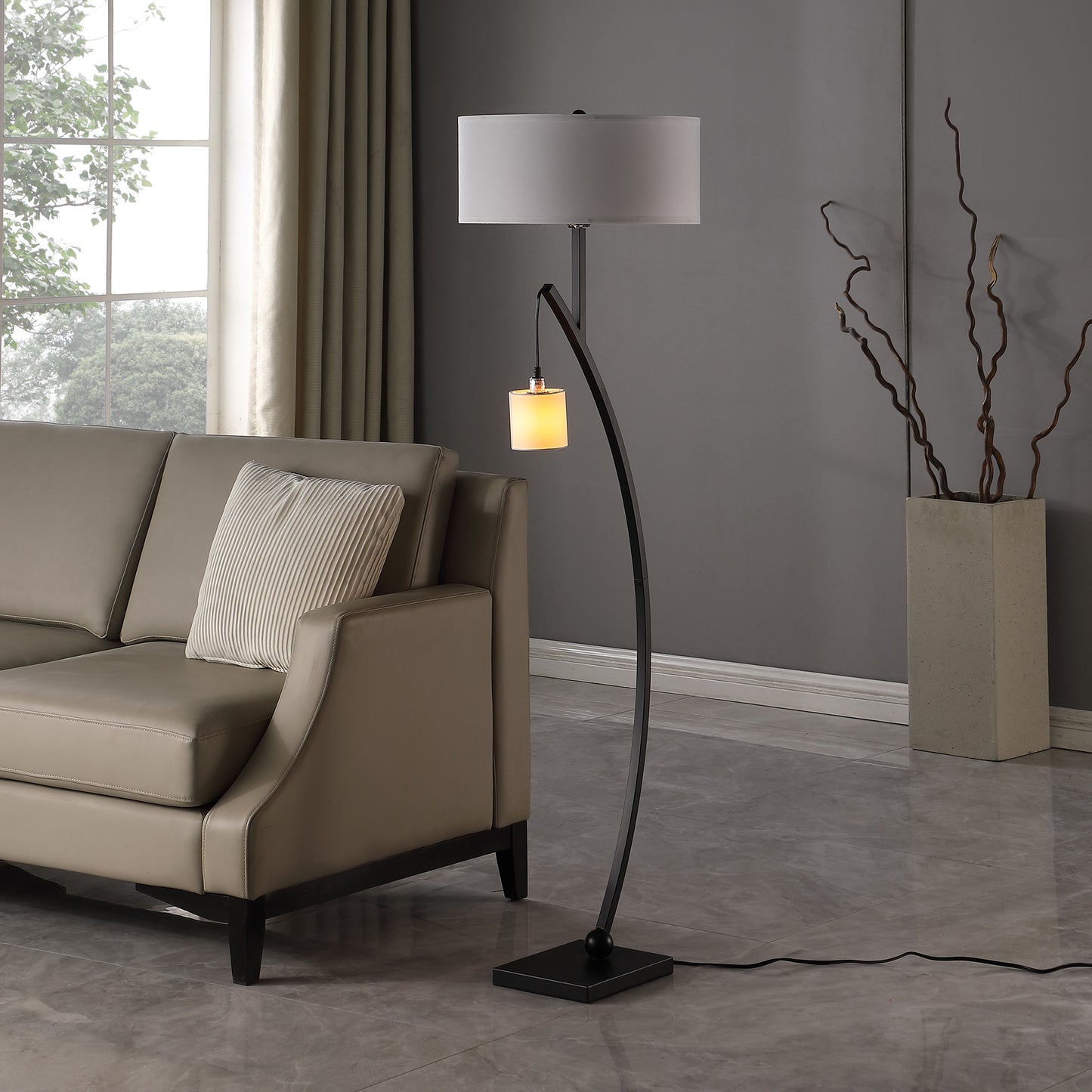 Modern black arc floor lamp with white drum shade and glass accent