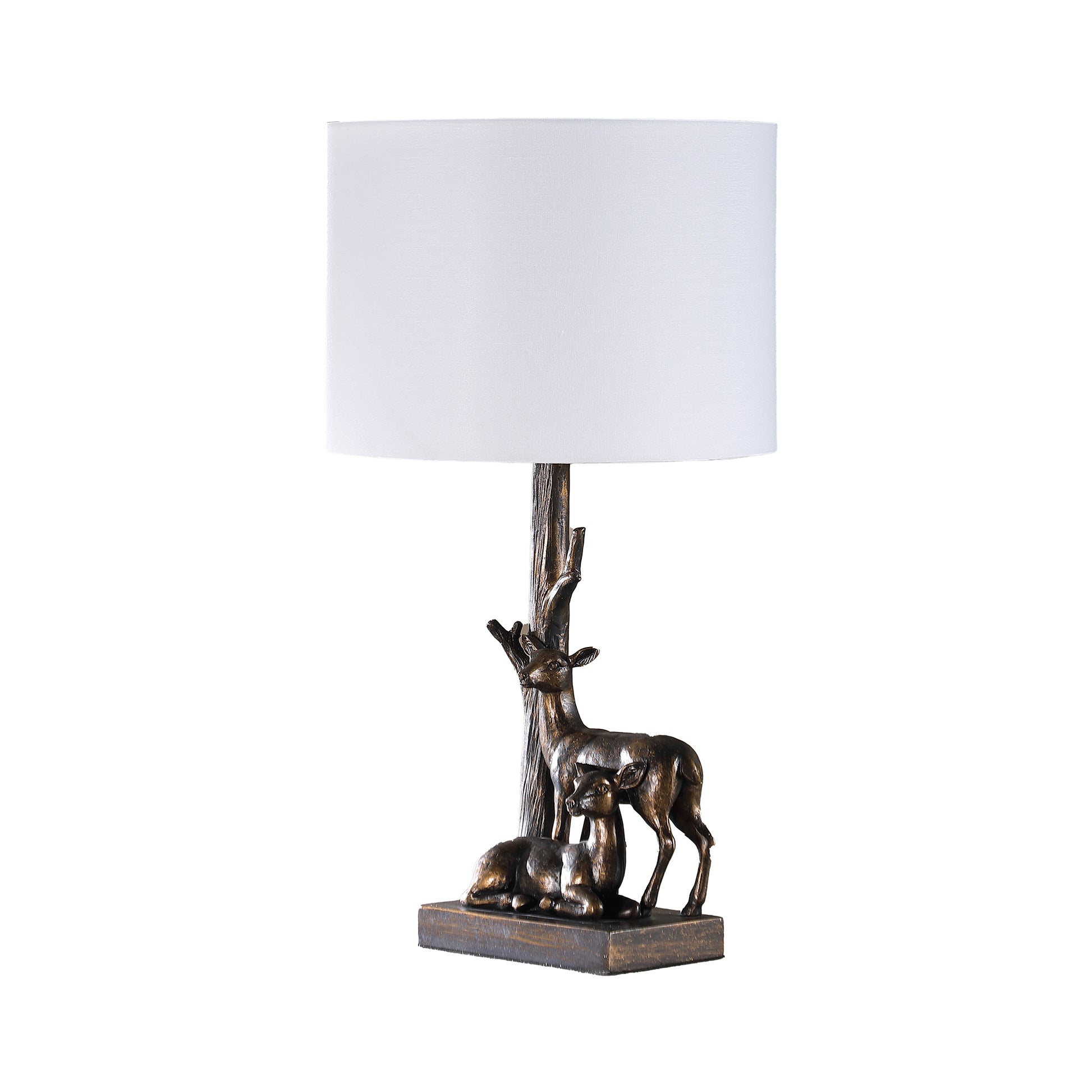 Bronze deer table lamp with a white linen shade and realistic tree trunk base
