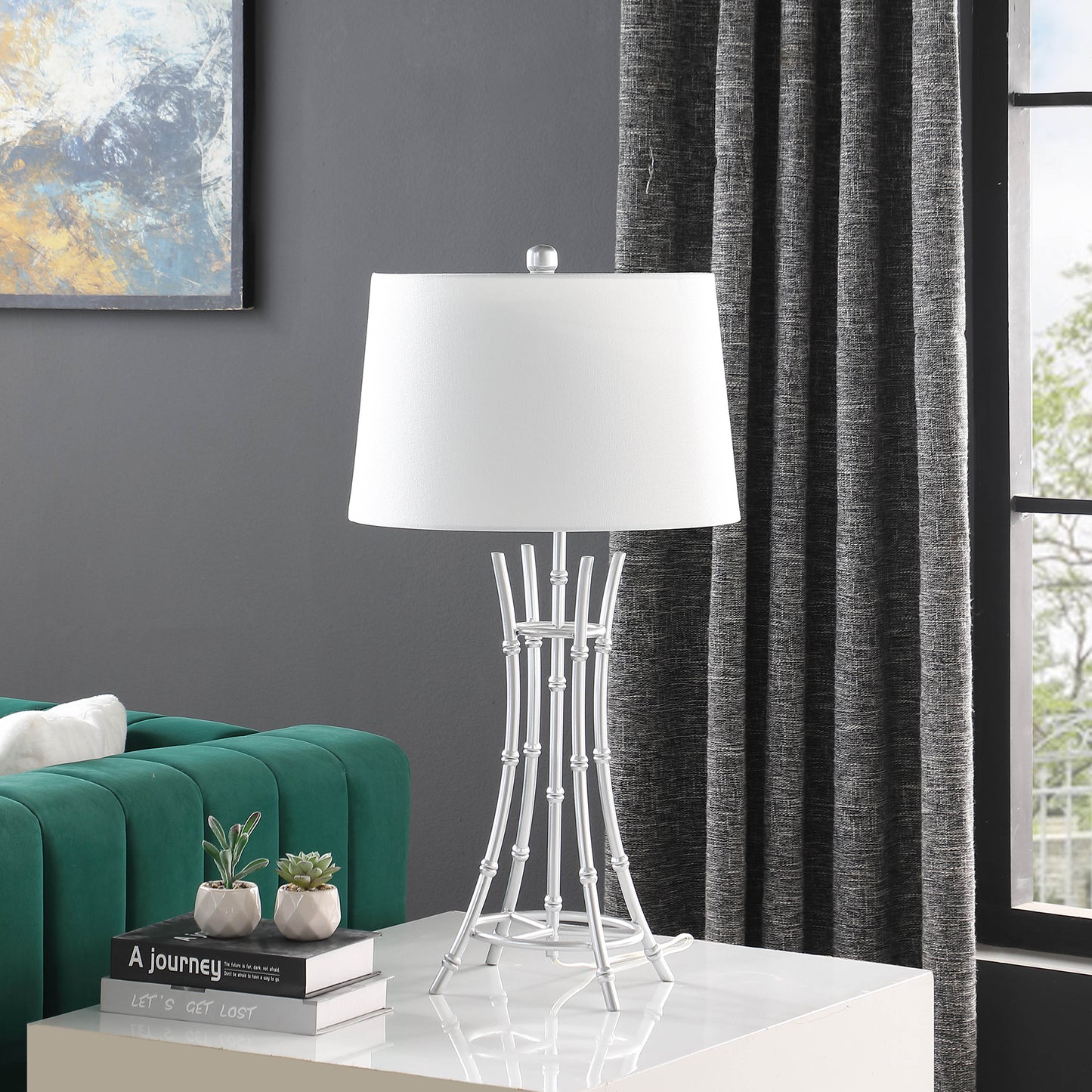 Modern silver table lamp with white drum shade and bambooinspired base