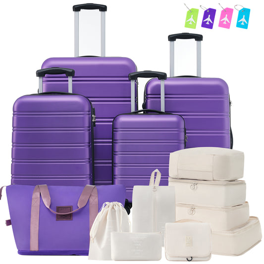 Set of four purple hard shell suitcases and travel organizers