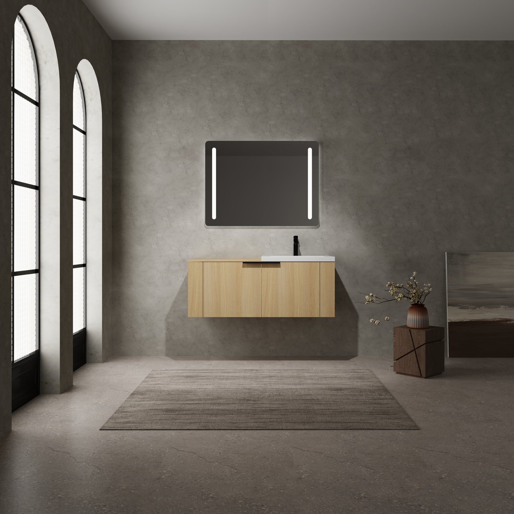 Light oak wood vanity with white countertop and modern black faucet featuring sleek design