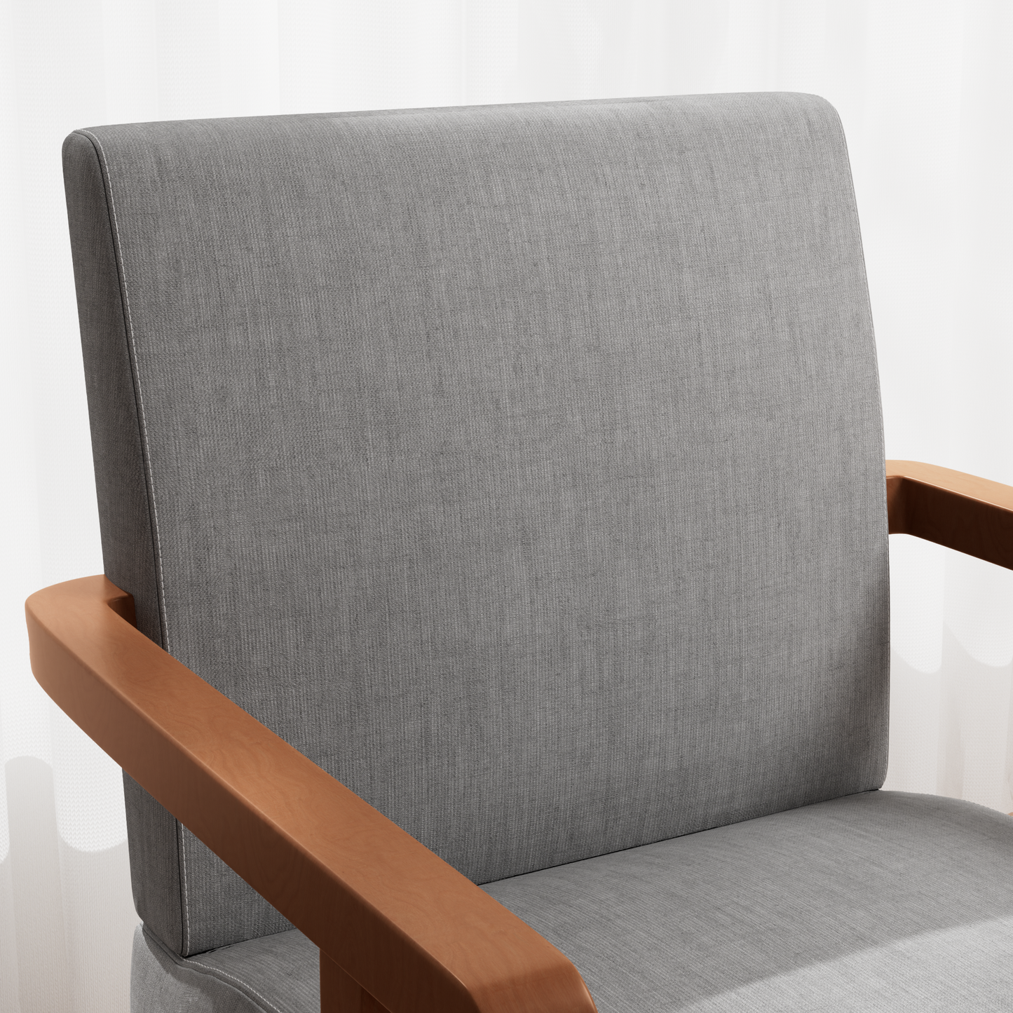 Closeup of a grey fabric armchair with smooth wooden armrests showing textured upholstery