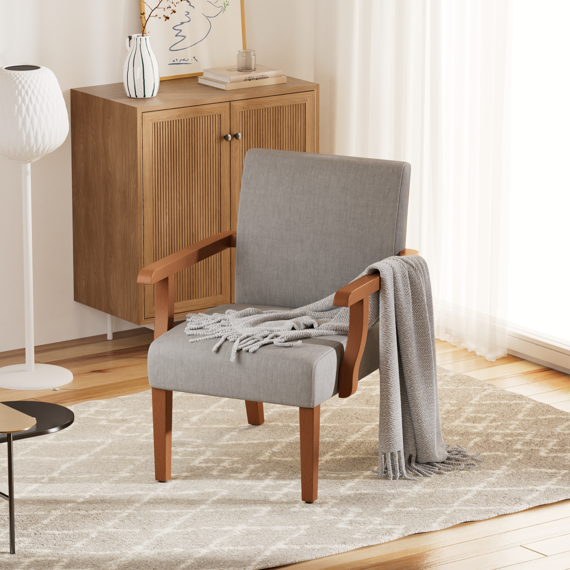 Upholstered grey accent chair with natural wood arms and legs perfect for a reading nook