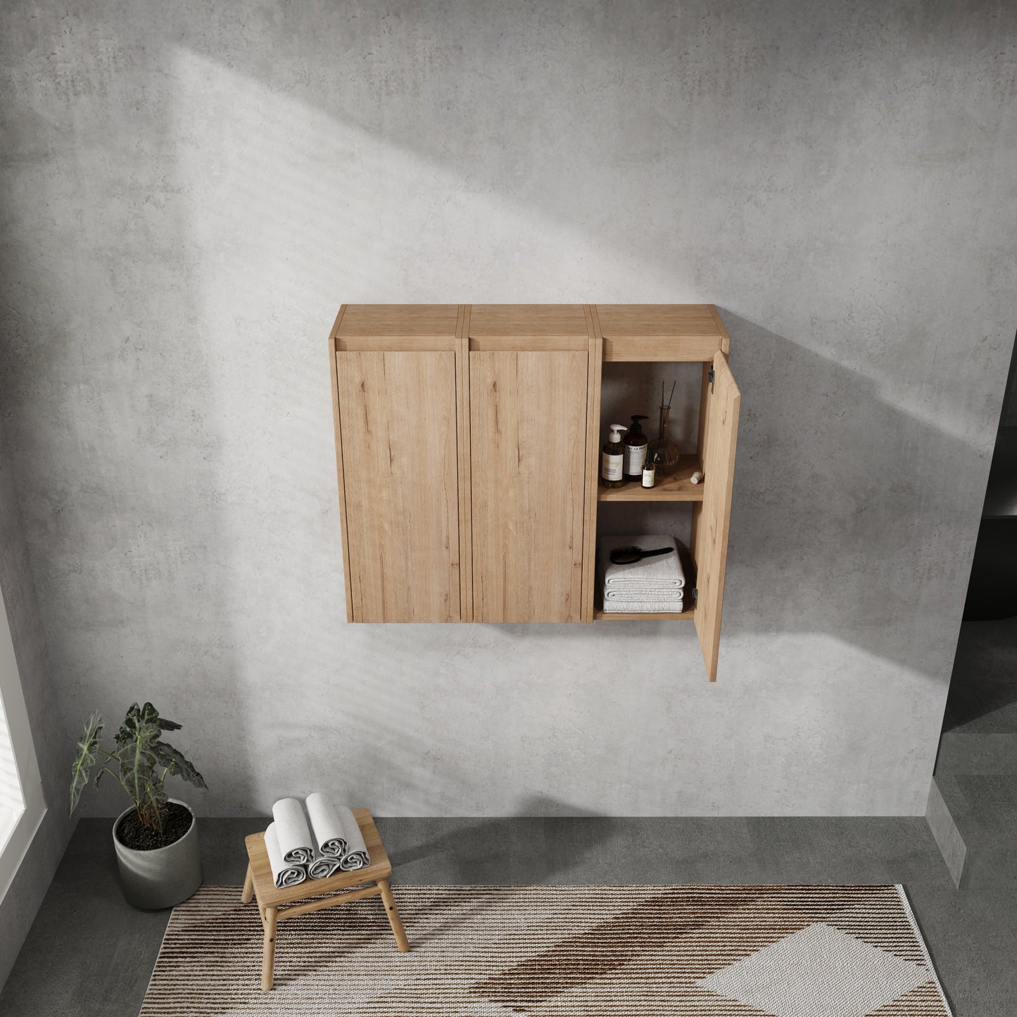 Light oak bathroom wall cabinet with open door showing toiletries and folded towels