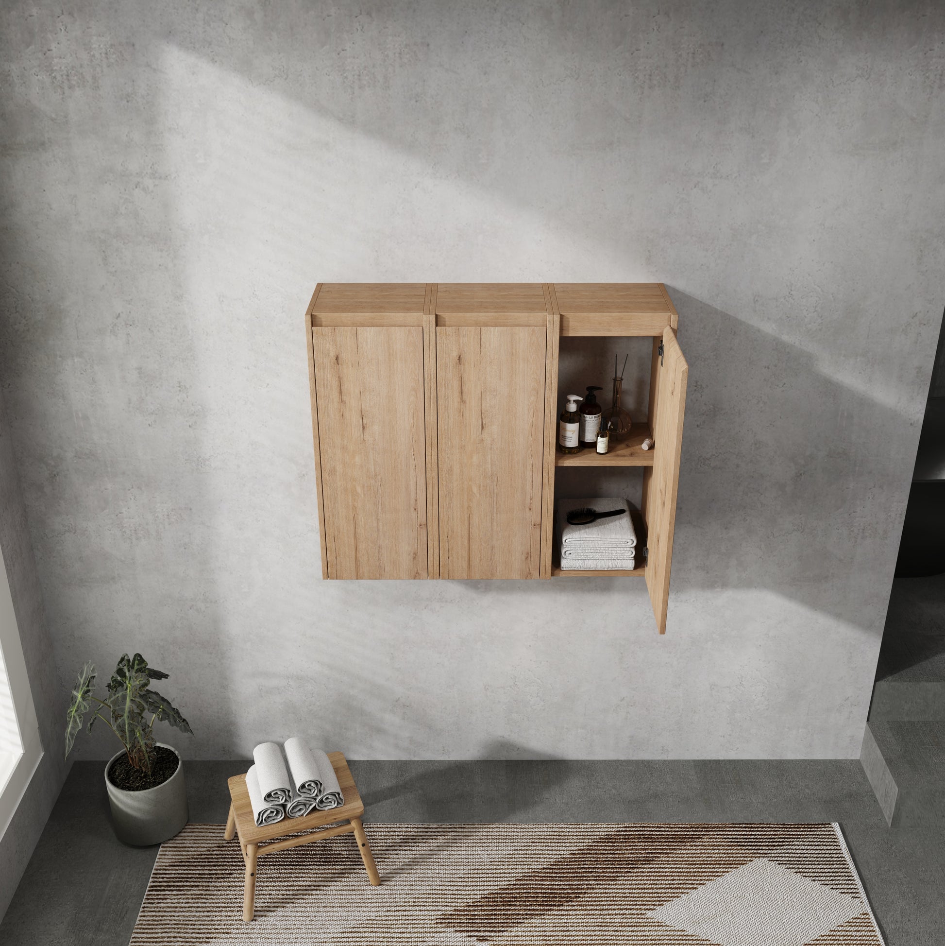 Light oak bathroom wall cabinet with open door showing toiletries and folded towels