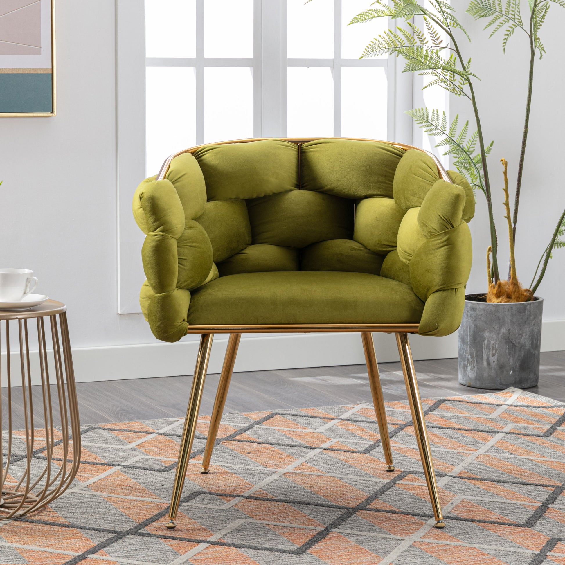 Plush lime green velvet armchair with tufted details and gold metal legs