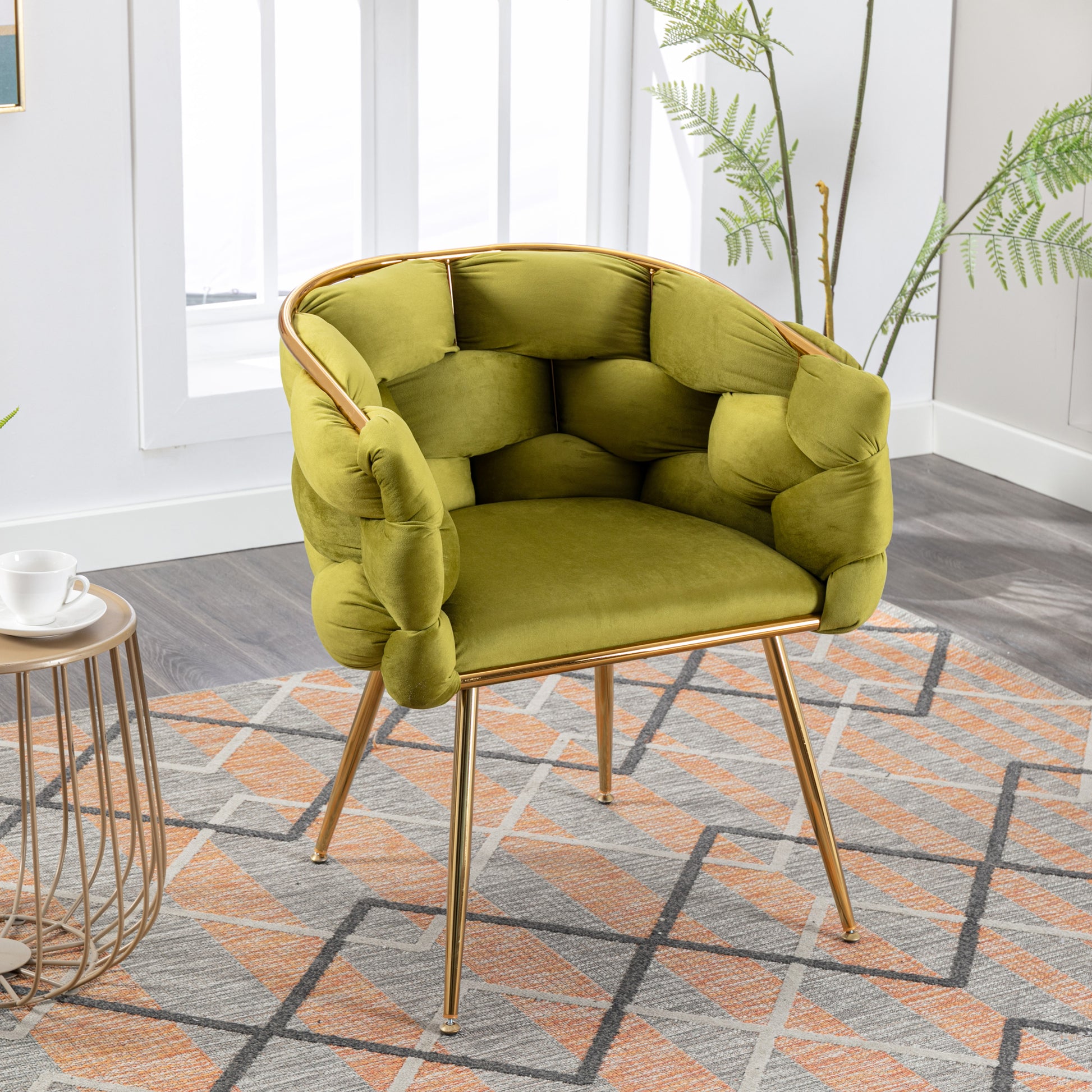 Plush olive green velvet accent chair with unique tufted detailing and gold metal legs