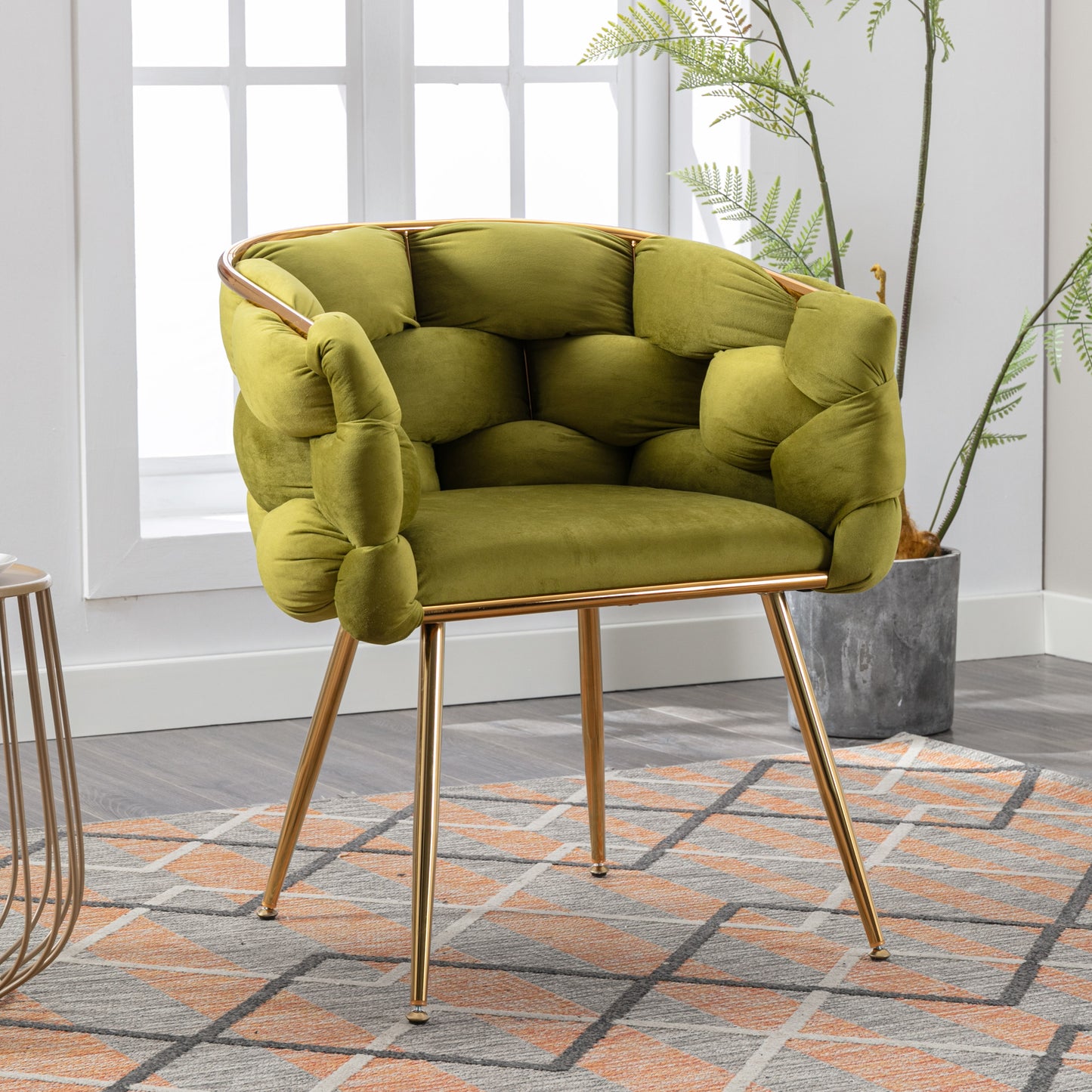 Plush lime green velvet accent chair with tufted design and gold metal legs